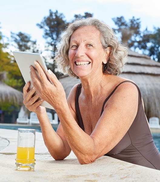 Woman Pool tablet – CyberSafe Seniors